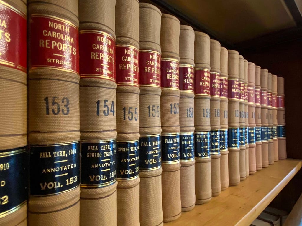Law books lined on a shelf.